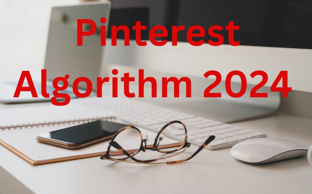 A desk with glasses, a smartphone, and a mouse beside a notebook and keyboard; text reads “Pinterest Algorithm 2024” in bold red font.