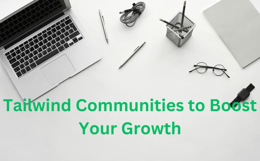Laptop and office supplies on a white desk with text: "Tailwind Communities to Boost Your Growth." Modern, professional tone.