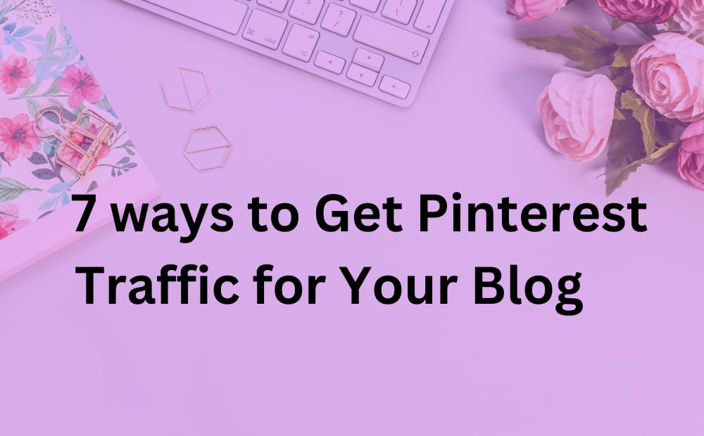 A floral notebook, keyboard, and pink flowers on a purple background with text: "7 ways to Get Pinterest Traffic for Your Blog." Feminine and creative theme.
